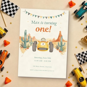 May include: A rectangular birthday invitation card featuring a yellow race car, desert landscape with cacti, and bunting. Text reads: Max is turning one! Saturday, June 14th, 11:00 AM - 2:00 PM, 123 Main Street, Anytown, RSVP to Mom at 555.123.4567 by June 1st.