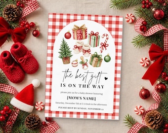 May include: A rectangular baby shower invitation card with a red and white buffalo check border. The center features watercolor illustrations of gifts, a tree, and baby booties. Text reads: The best gift is on the way, honoring [MOM'S NAME].