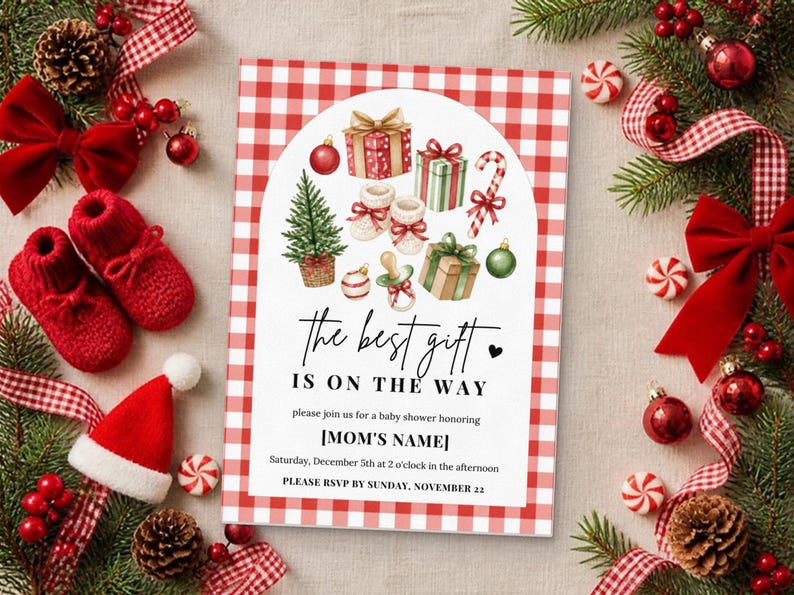 May include: A rectangular baby shower invitation card with a red and white buffalo check border. The center features watercolor illustrations of gifts, a tree, and baby booties. Text reads: The best gift is on the way, honoring [MOM'S NAME].