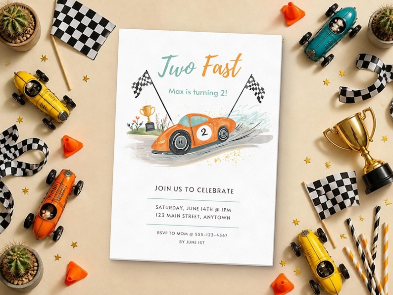 May include: A rectangular birthday invitation card featuring an orange race car with the number 2, checkered flags, and a gold trophy. The text reads: Two Fast, Max is turning 2!, JOIN US TO CELEBRATE, SATURDAY, JUNE 14TH @ 1PM, 123 MAIN STREET, ANYTOWN, RSVP TO MOM @ 555-123-4567 BY JUNE 1ST.