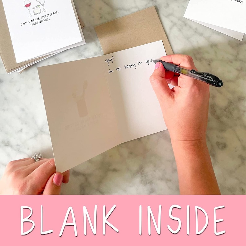 May include: A blank greeting card with the text "yay! I'm so happy for you" written on the inside. The card is folded in half and the front is blank.