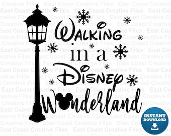 May include: Black and white silhouette design featuring a street lamp, Mickey Mouse ears, snowflakes, and the text "Walking in a Disney Wonderland".
