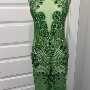 May include: A set of three ceramic mugs with a speckled, matte finish. The mugs are in shades of cream, light gray, and dark gray. Each mug has a simple, modern design and a rounded handle.