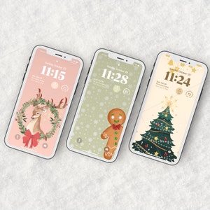 May include: Three different phone screen designs with a Christmas theme. The first design features a pink background with a deer in a wreath. The second design features a green background with a gingerbread man. The third design features a cream background with a Christmas tree.