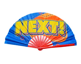 May include: A blue and red hand fan with the word "NEXT!" printed in yellow on the front. The fan is decorated with a red and orange pattern.