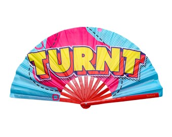 May include: A blue and pink hand fan with a red handle. The fan has a graphic design with the word "TURNT" in yellow letters.