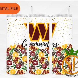 May include: A white tumbler with a gold and maroon floral design. The tumbler has a gold glitter background and the text "Commanders" in black. The tumbler is a digital file.