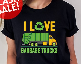 May include: A black t-shirt with a green garbage truck and the text "I LOVE GARBAGE TRUCKS". The recycle symbol is incorporated into the word "LOVE".