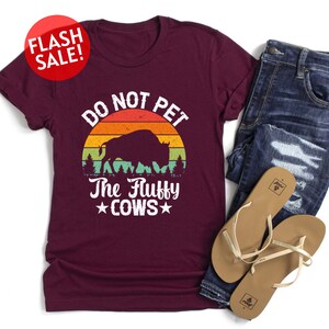 a t - shirt that says do not pet the ugly cows