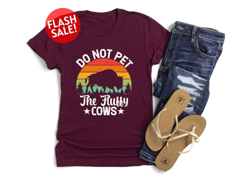 a t - shirt that says do not pet the ugly cows
