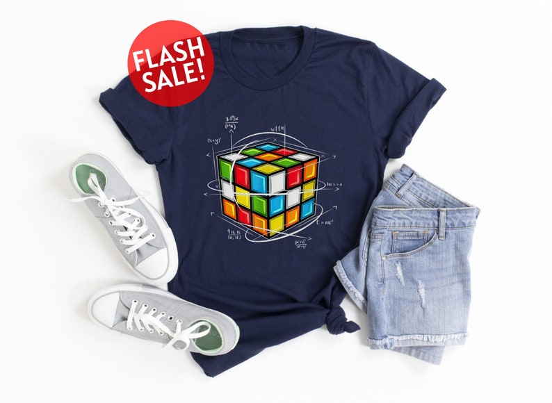 a t - shirt that has a rubik cube on it
