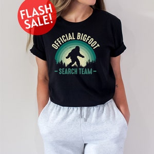 a woman wearing a black shirt with a bigfoot search team on it