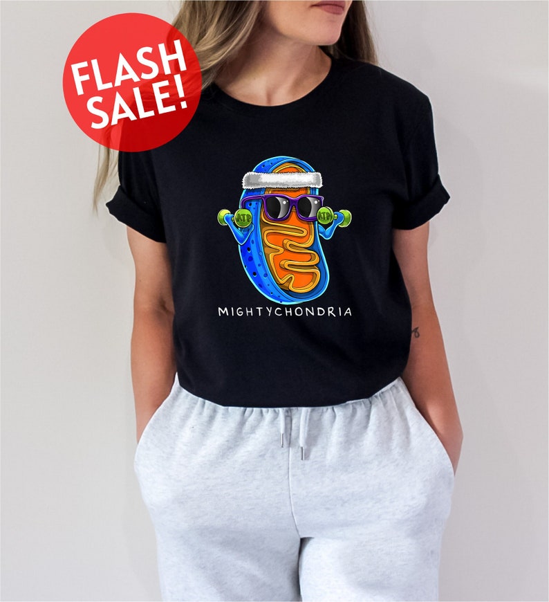 a woman wearing a black shirt with a picture of a hot dog wearing sunglasses