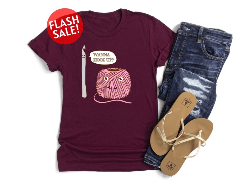 a women's t - shirt with a picture of a yarn ball and a