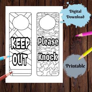 May include: Two printable door hangers with black outlines. One says "KEEP OUT" and the other says "Please Knock". The door hangers are on a white background with a wooden texture. Colored pencils and text that says "Digital Download" and "Printable" are also visible.
