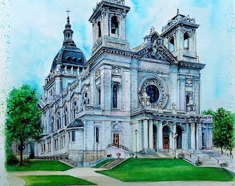 May include: A watercolor painting of a large stone cathedral with a central dome and two towers, set against a blue sky. The text "Max & Rachel" and "May 6, 2023" is written at the bottom. A small inset photo of the same building is in the top corner.
