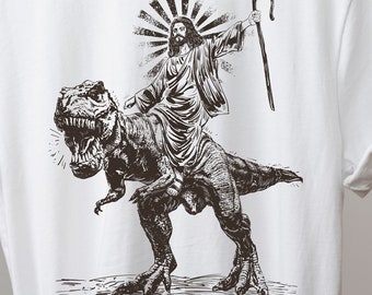 Jesus Riding T rex Dinosaur Shirt | Cool Tee | Jesus T-shirt | Wild Dinosaur Shirts | Christ on Trex Tshirt | Christian Tee Gifts | Religion