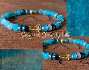 Bracelet with cross charm.