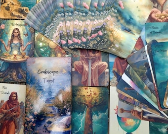 May include: A collection of tarot cards with watercolor illustrations. The cards feature images of nature, figures, and symbols. The deck includes a box labeled "Crabscape Tarot". Some cards are fanned out, displaying their detailed artwork.