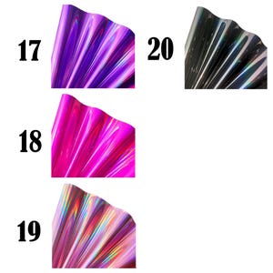 May include: Four sheets of iridescent film labeled 17, 18, 19, and 20. Sheet 17 is purple, 18 is bright pink, 19 is a light pink with rainbow reflections, and 20 is a dark grey with metallic highlights. Each sheet has a wavy, pleated texture.