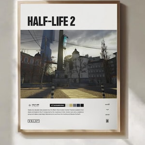 May include: A framed poster featuring the text "HALF-LIFE 2" at the top. The poster displays a cityscape with a tall structure in the background. Below the image are details including the date "16th November 2004" and the Valve logo.