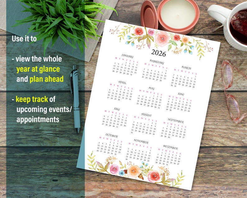 May include: A printable calendar for the year 2026 with floral illustrations. Each month is displayed in a separate box with a white background and black text. The calendar is decorated with watercolor flowers in shades of pink, orange, and blue.
