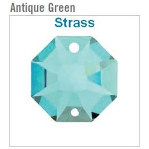 May include: An octagonal, antique green Strass crystal with two holes. The crystal has a multifaceted design, reflecting light with a shimmering effect. The text "Antique Green" and "Strass" are displayed above the crystal.