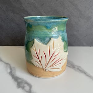 Earthly Elegance: Handmade Pottery Mug with a Touch of Copper Green
