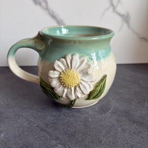 Handmade Pottery Daisy Mug – 3D Floral Pottery Cup, Wheel-Thrown, Hand-Sculpted & Hand-Painted Ceramic