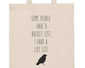 May include: A natural canvas tote bag with black text that reads "Some people have a bucket list, I have a life list." A black silhouette of a bird is below the text.