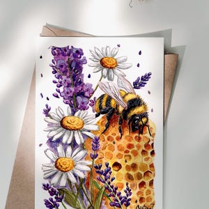 May include: Watercolor illustration of a bee on a honeycomb, surrounded by daisies and lavender. The bee is black and yellow, with white daisies and purple lavender. The artwork is on a white card with a brown envelope.