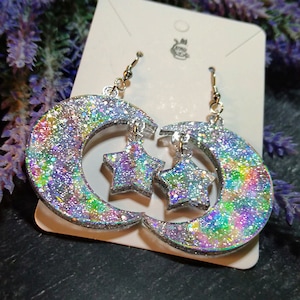 Silver glittering moon earrings with rainbow effect and smaller star - color changes depending on the light