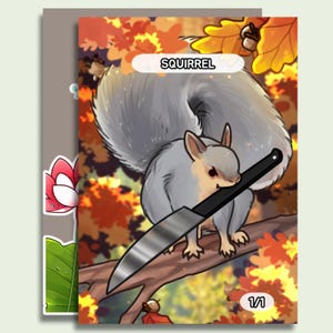 May include: A cartoon illustration of a gray squirrel holding a large knife, perched on a tree branch. The word "SQUIRREL" is displayed above the squirrel. The background features autumn leaves and the number "1/1".