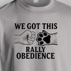 Paws & Fists Unite! Funny Rally Obedience Dog Trainer T-Shirt – We Got This!