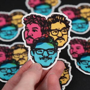 May include: A sticker sheet featuring four colourful illustrations of people wearing glasses. Each illustration is outlined in white and has a unique colour scheme. The sticker sheet is on a black background.