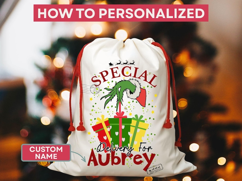 May include: A white Christmas gift bag with red drawstrings. The bag features a Grinch-themed design with the words "Special Delivery For Aubrey". The bag also has a red banner that says "How to Personalize".