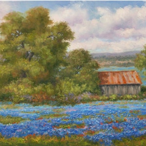 May include: A painting of a rustic wooden barn with a rusty metal roof, surrounded by a field of blue wildflowers. The barn is situated in a rural landscape with a distant view of a lake and trees.