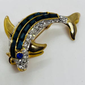 dark blue sapphire carved fish hook Blue Sapphire Fish
