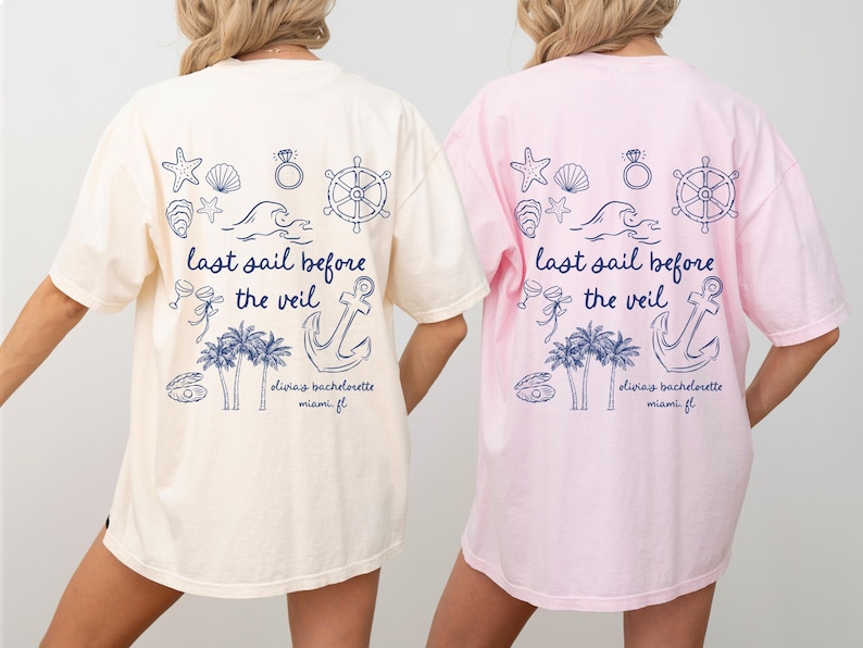 May include: Two white and pink t-shirts with a nautical theme. The shirts feature a graphic of an anchor, palm trees, seashells, a ring, and a ship's wheel. The text on the shirts reads "last sail before the veil" and "diviay bachelorette miami fl".
