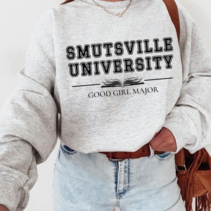 May include: A gray sweatshirt with the text "Smutsville University" and "Good Girl Major" printed on it.