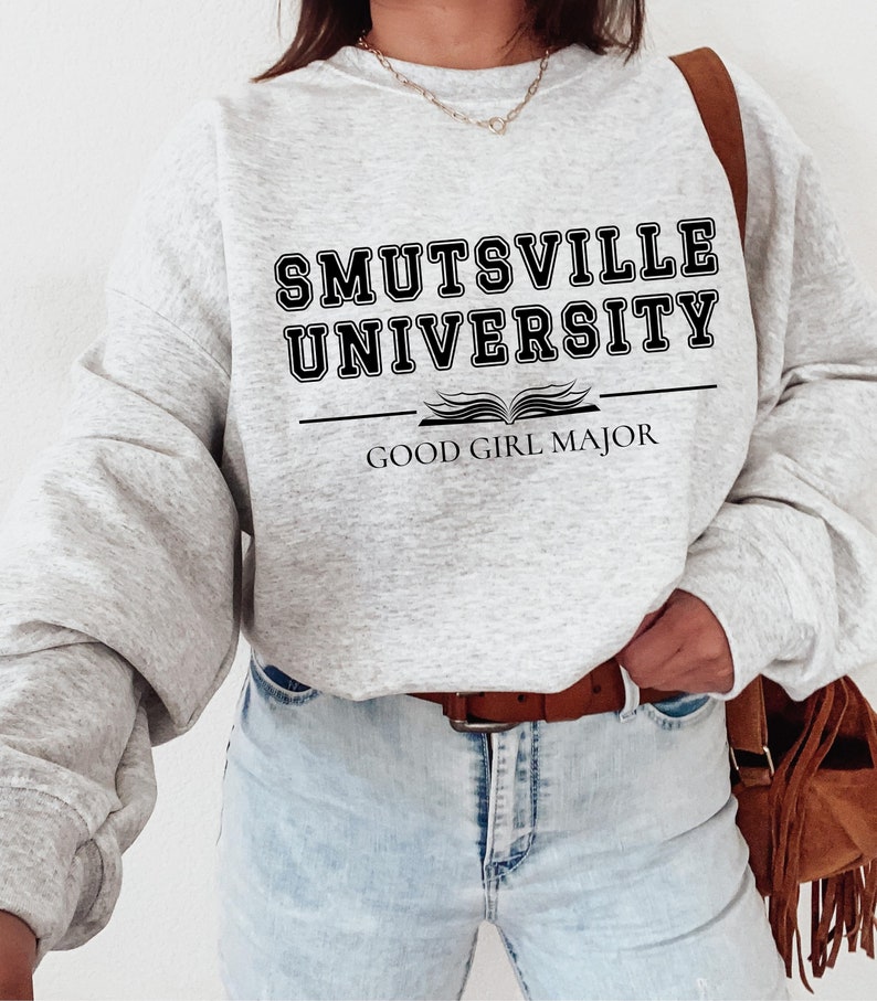May include: A gray sweatshirt with the text "Smutsville University" and "Good Girl Major" printed on it.