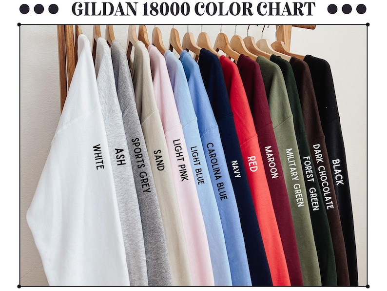 May include: Colour chart for Gildan 18000 t-shirts, displaying 14 different colours: black, dark chocolate, forest green, military green, maroon, red, navy, Carolina blue, light blue, light pink, sand, sports grey, ash, and white.