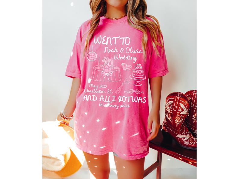 May include: Pink t-shirt with a white graphic design that says "Went to Noah & Olivia Wedding May 2025 Charleston, SC and all I got was this lousy shirt".