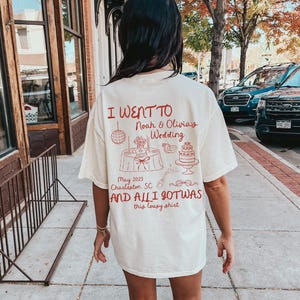 May include: A white t-shirt with red text that says "I went to Noah & Olivia's Wedding May 2025 Charleston, SC and all I got was this lousy shirt".