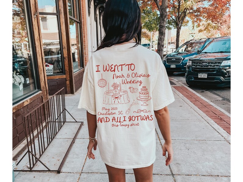 May include: A white t-shirt with red text that says "I went to Noah & Olivia's Wedding May 2025 Charleston, SC and all I got was this lousy shirt".