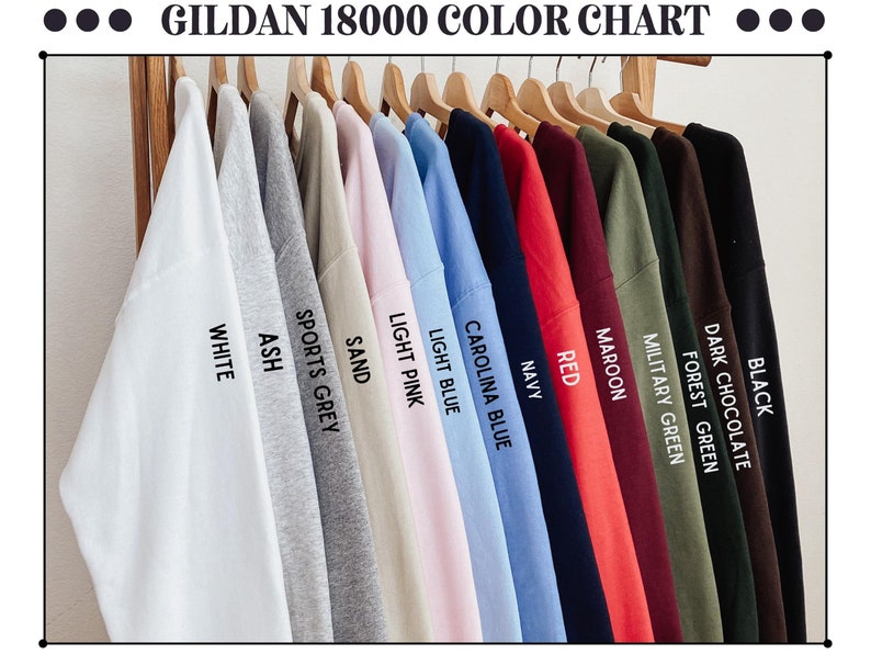 May include: Color chart for Gildan 18000 t-shirts, showing 14 different colors: black, dark chocolate, forest green, military green, maroon, red, navy, Carolina blue, light blue, light pink, sand, sports grey, ash, and white.