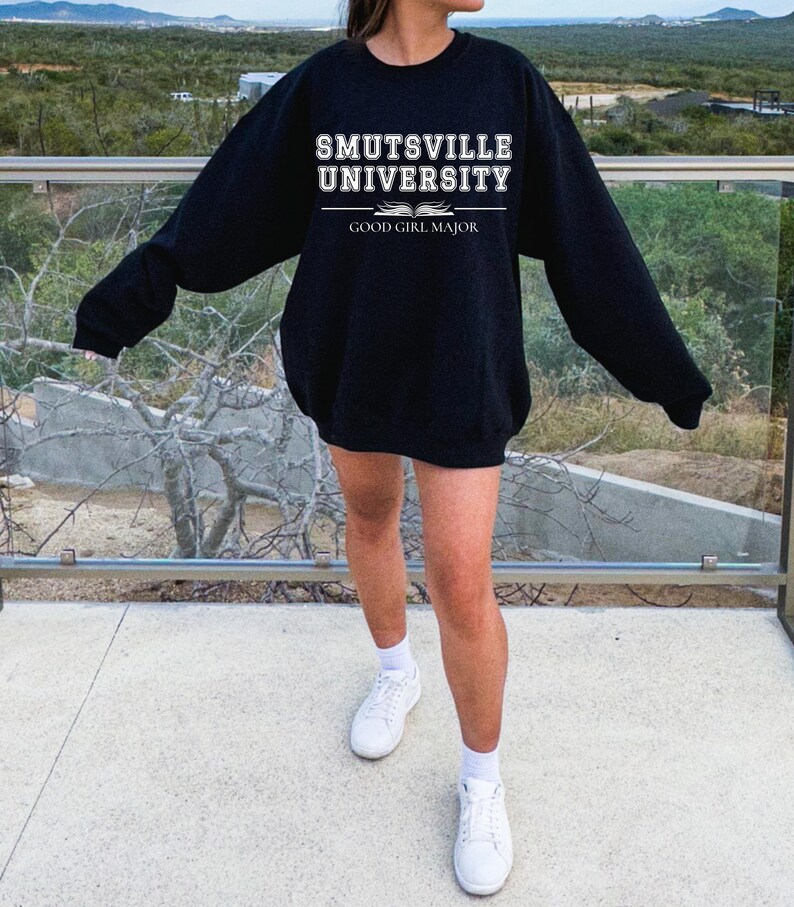 May include: Black sweatshirt with white text that reads "Smutsville University Good Girl Major".