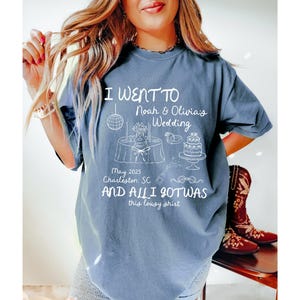 May include: A blue t-shirt with white text that reads "I went to Noah & Olivia's Wedding May 2025 Charleston SC and all I got was this lousy shirt".