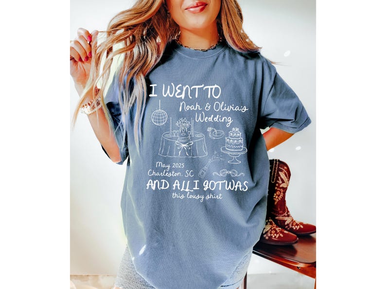 May include: A blue t-shirt with white text that reads "I went to Noah & Olivia's Wedding May 2025 Charleston SC and all I got was this lousy shirt".