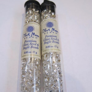 2 new vials of glass Blue Moon Beads - clear crystal colored